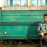 Poster film Into the Wild 2007 Christopher McCandless duduk di depan bus di Alaska